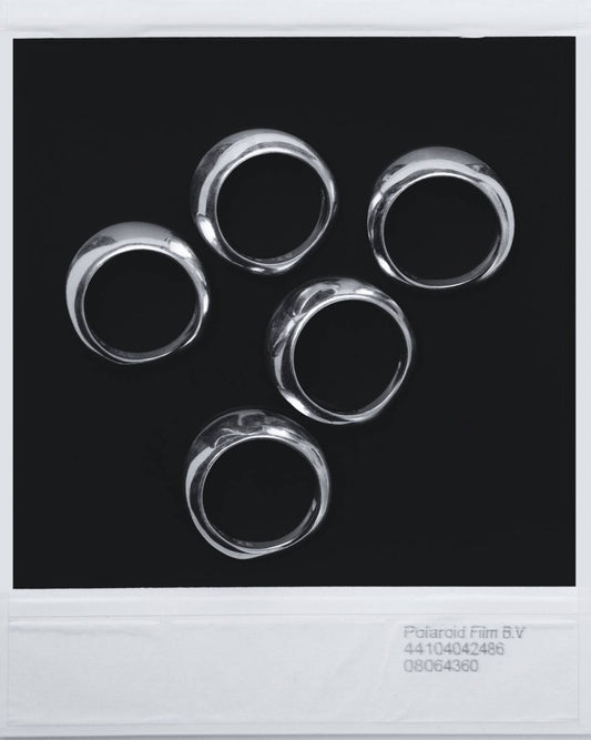 Stacked sculptural silver rings by SY, Solénne — model 00.30 from Le Vide collection, minimal and timeless design
